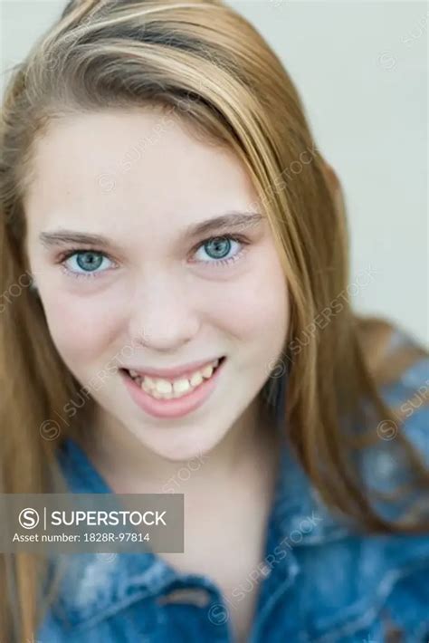 Close Up Portrait Of Pre Teen Girl Smiling And Looking At Camera1011