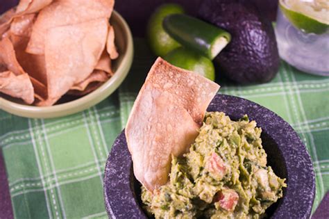 Serve it up with your favorite tortilla chips, in (or on) a burrito. Baked Tortilla Chips and Guacamole - The Girl in the ...