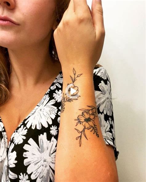 wrist tattoo flower in 2021 wrap around wrist tattoos forearm tattoo women wrist tattoos