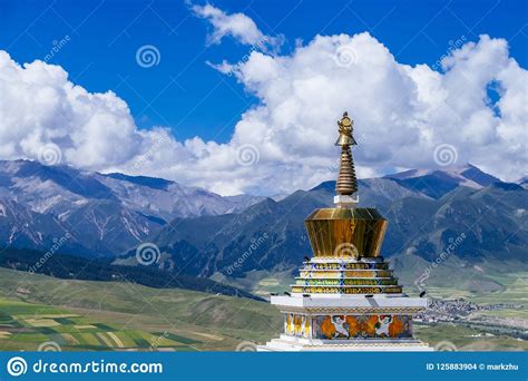 Tibetan Pagoda Against Mountains And Landscape Of Qinghai China Stock