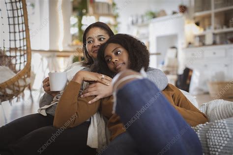 Mother And Daughter Cuddling On Sofa Stock Image F0334501 Science Photo Library