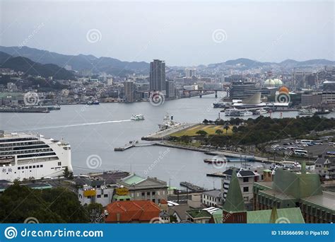 Nagasaki Port With Ferries And Cruiseboats Surrounded By
