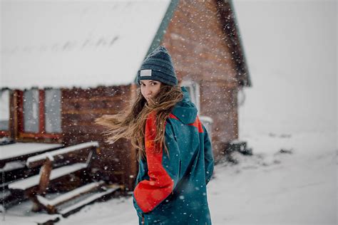 Woman Going To A Wooden Cabin To Hide From A Blizzard Del Colaborador