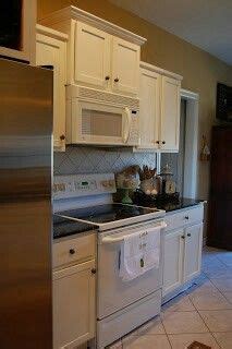 What size cabinet goes above stove? Microwave above stove depth stacked raised and bumped out ...