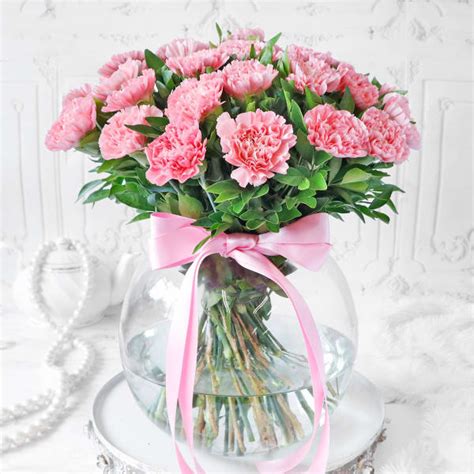 Order Bouquet Of Light Pink Carnations In Globe Vase 25 Stems Online At
