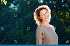 tranquil standing older woman happy park preview