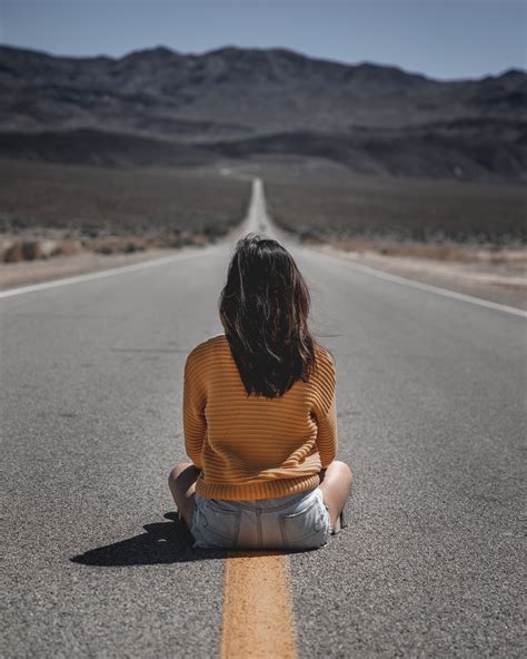 Woman Sitting On Road · Free Stock Photo