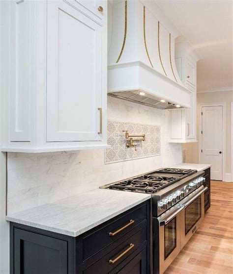 Finally, with two daughters off to college and one in high school, they were ready to tackle a renovation. dark lower cabinets and white upper cabinets to create two ...