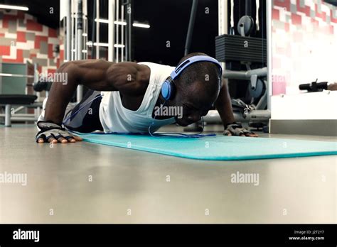Sport Young Athletic Man Doing Push Ups At Gym Muscular And Strong