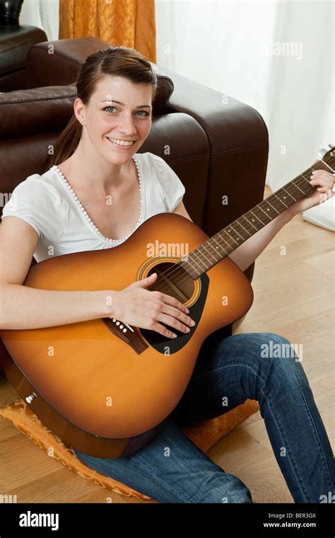 Young Woman Playing The Guitar Stock Photo Alamy