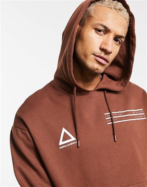 Asos Unrvlld Supply Oversized Hoodie In Brown With Front Logos Asos