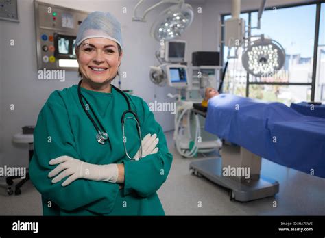 Portrait Of A Female Surgeon Sitting In Operation Theater Stock Photo