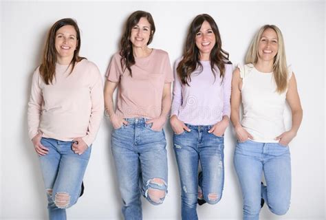 Portrait Of Four Best Friends Women In Studio Standing Stock Photo