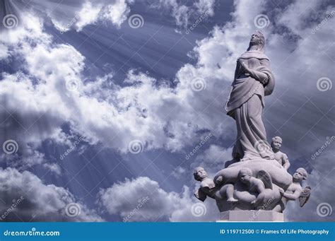 Mother Mary Surrounded By Angels With Light From Heaven Stock Photo