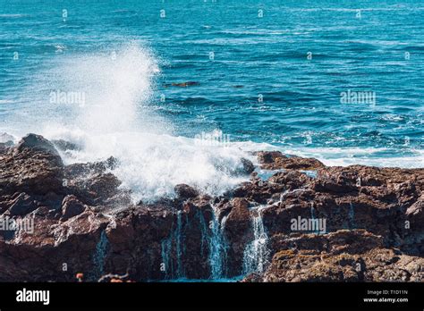 Ocean Waves Crashing Against Rocks Closeup Stock Photo Alamy
