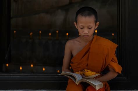 Premium Photo Young Buddhist Novice Monk Reading Young Buddhist