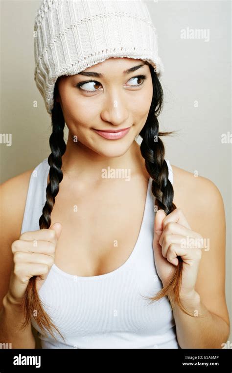 Mixed Race Woman Pulling Her Pigtails Stock Photo Alamy