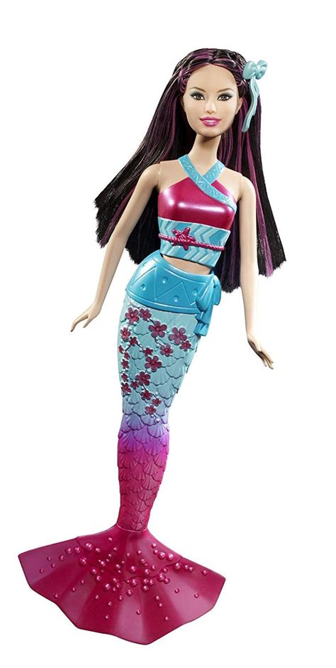 a barbie doll wearing a pink and blue dress with long black hair standing in front of a white