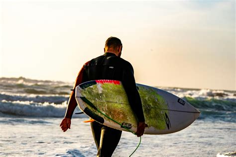 Man Holding Surfboard · Free Stock Photo