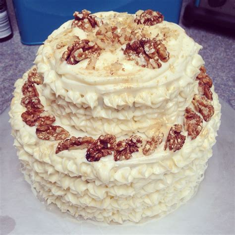 In another bowl, stir together the carrots, chopped nuts, coconut and raisins. Two tiered carrot cake with walnuts | Carrot cake, Cake ...