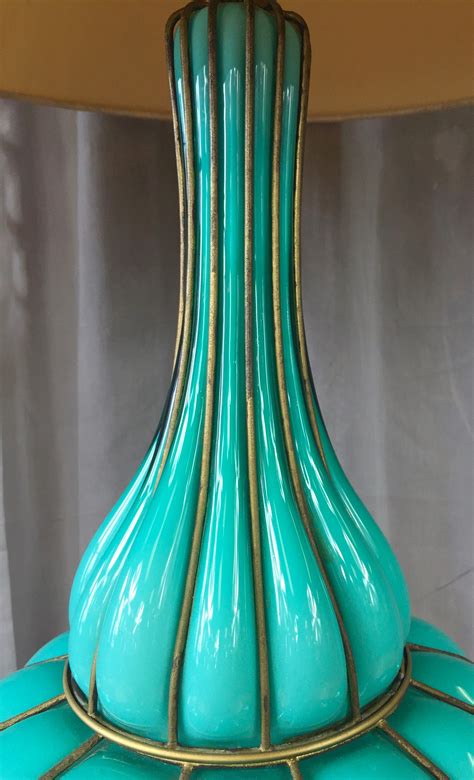 Showcasing all the features that brought murano glass masters their enduring fame, this vase is like the quintessence of venetian opulence, artistry. Monumental Turquoise-Colored Murano Glass and Brass Table ...
