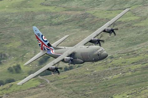 50 Years Of Excellence Raf Hercules Low Through Snowdonia