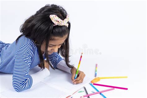 Cute Left Handed Girl Is Writing With A Pencil Stock Photo Image Of