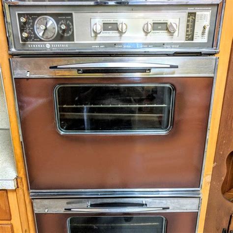 ge 1960s appliances double oven cooktop and range hood retro brown and silver vintage kitchen