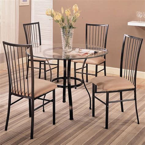 Is it a table, or a work of modern abstract art? Clear Glass Top Modern 5 Pc Round Dinette Set w/Black Frame
