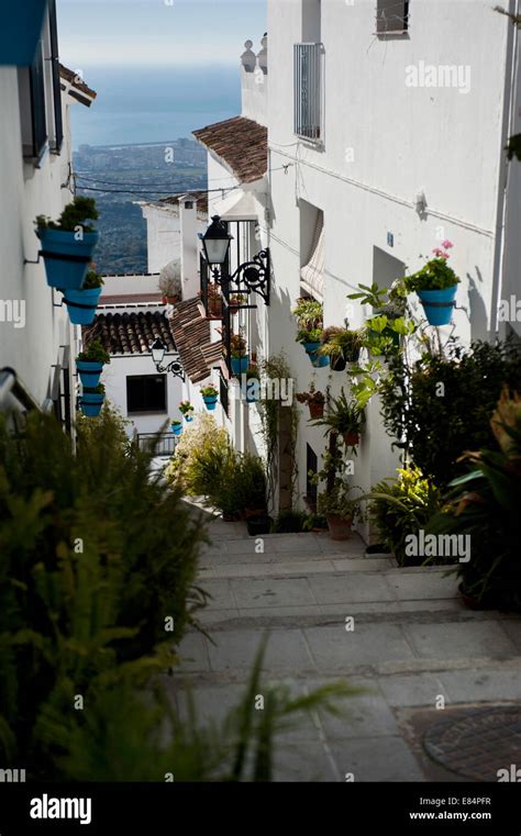 A View Down An Alleyway In The Spanish Village Of Mijas With