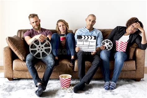 Sad Group Of Friends Holding Movie And Film Objects Stock Photo Image