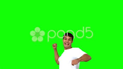 Happy Man Raising His Arm On Green Screen Stock Footage Ad Raisingarmhappyman
