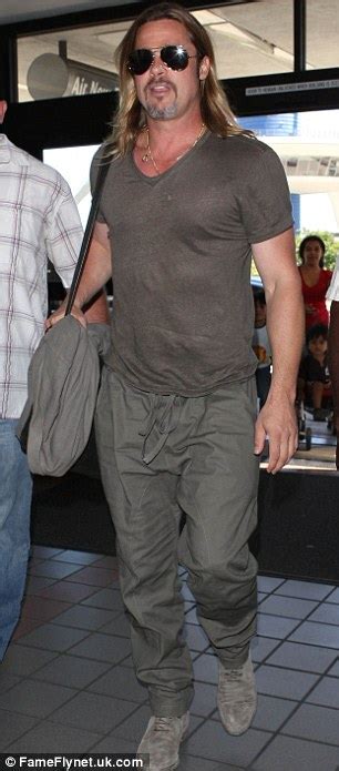 Brad Pitt Shows Off His Toned Torso Through A Tight Nearly Sheer T Shirt As He Jets Out Of Lax