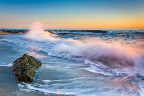 Waves Crashing On Rocks At Sunset At Victoria Beach Stock Image
