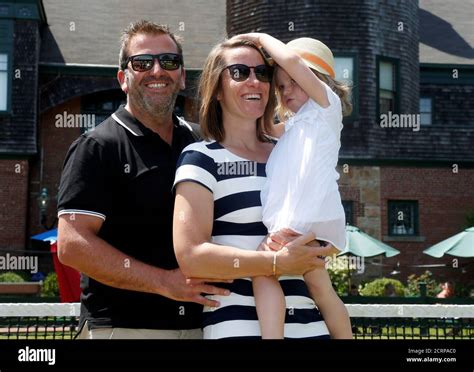 Justine Henin Of Belgium Holds Her Daughter Lalie 3 As She Poses For