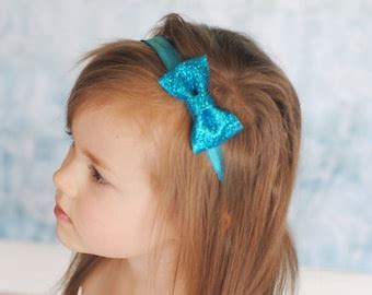 Items Similar To Turquoise Glitter Bow Headband On Etsy