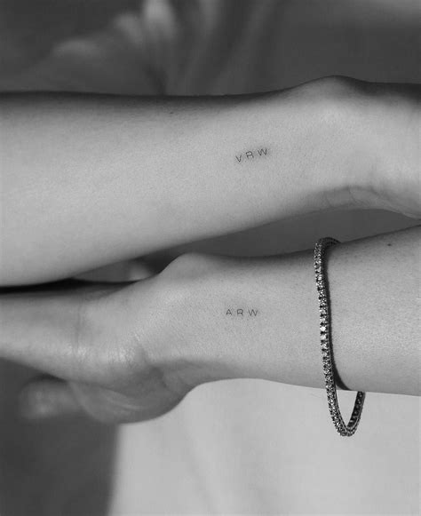 Childrens Initials Tattoo By Jakub Nowicz Inked On Both Wrists Tiny