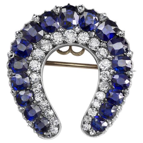 Antique No Heat Blue Sapphire And Diamond Horseshoe Brooch For Sale At