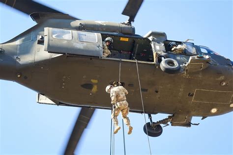 Army Students Attending The Deglopper Air Assault School Rappel From A
