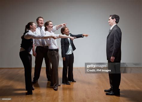 Business People Laughing At Man High Res Stock Photo Getty Images