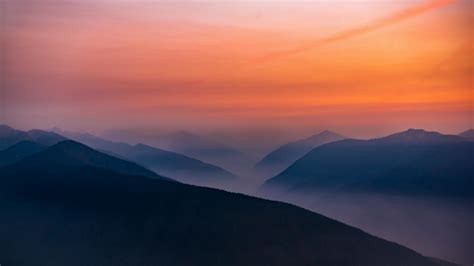 Download 1366x768 Wallpaper Hazy Sunset Mist Mountains Horizon