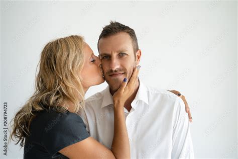 Loving Wife Kissing Handsome Husband And Touching His Face Tanned Young Woman Falling In Love