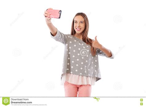 Caucasian Girl In Cheerful Mood Is Making Selfie Photo Via Smart Stock