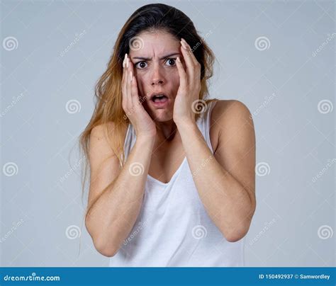 Portrait Of A Young Attractive Woman Looking Scared And Shockedhuman