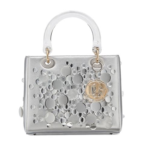 Soft lambskin topstitched with the iconic cannage motif the lady dior handbag is a house classic defined by its cannage topstitching, 'd.i.o.r.' charm and structured silhouette. How to get your hands on the Dior Lady Art #3 collection ...
