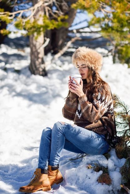 Premium Photo Young Woman Enjoying The Snowy Mountains In Winter