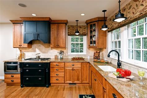 The homeowner had freshly painted walls and trim in a light gray and white and hung new lighting as a good start to an update. How to Update a Kitchen Without Painting Your Oak Cabinets