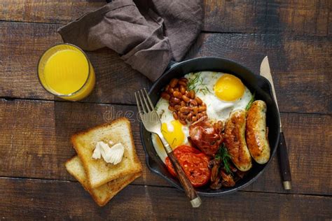 Full English Breakfast On Dark Wooden Background Top View Stock Image