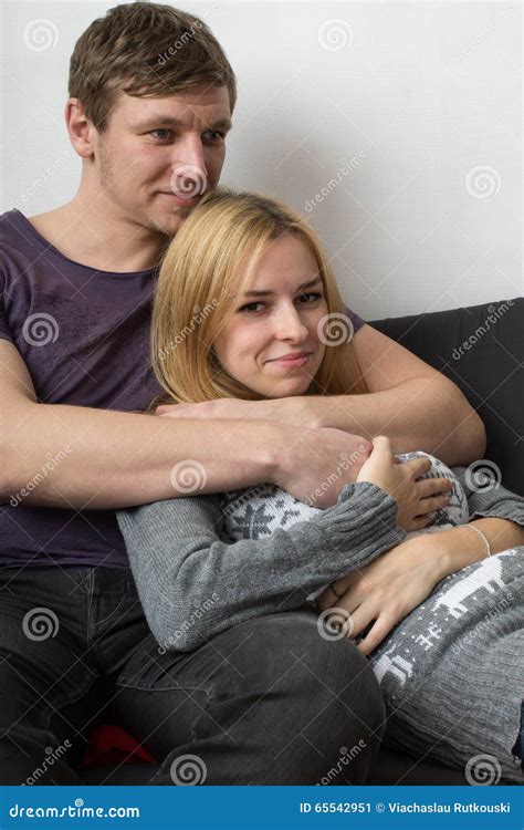 Boyfriend Hugging His Girlfriend On The Couch Stock Image Image Of