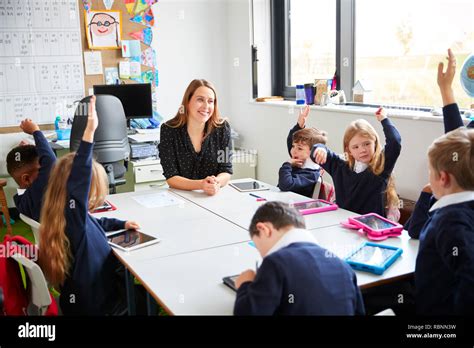 Primary School Classroom With Smiling Children Hi Res Stock Photography